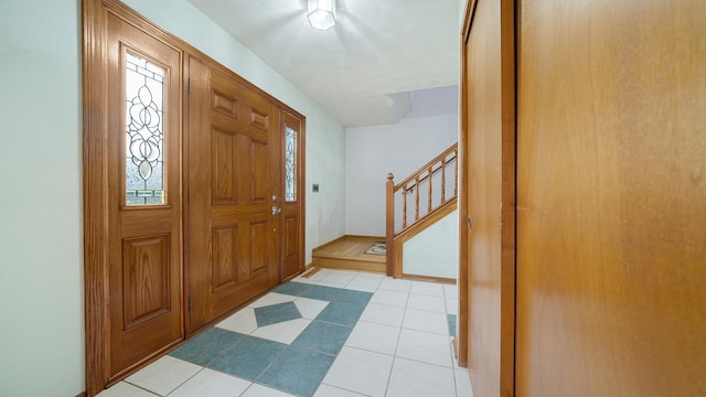 4401 Windsor Ct, Loves Park, IL 61111 - foyer with stairway and light tile patterned floors