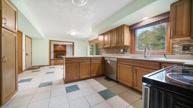 4401 Windsor Ct, Loves Park, IL 61111 - kitchen with stainless steel dishwasher, a sink, a peninsula, and backsplash