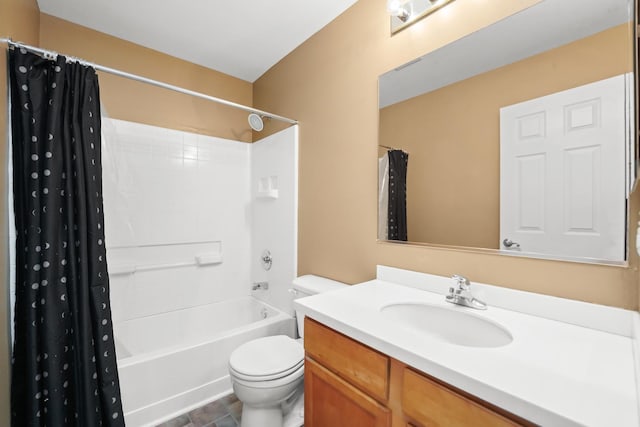 bathroom featuring toilet, shower / tub combo, and vanity