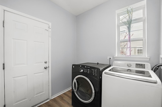 laundry room featuring laundry area, baseboards, dark wood-style floors, and washer and dryer