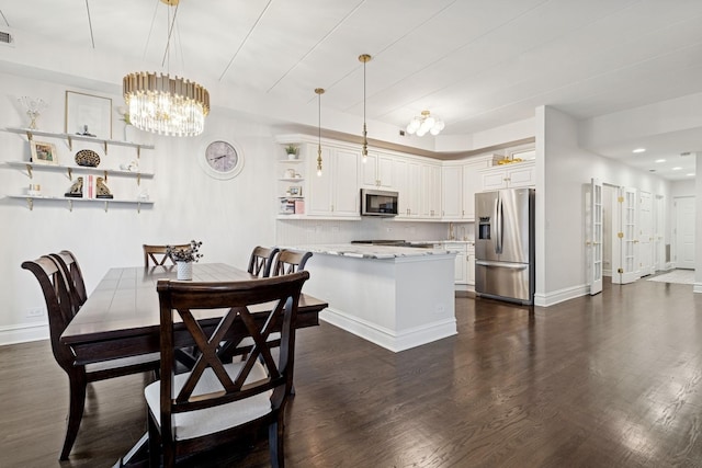 1111 W Madison St Unit 5B, Chicago, IL 60607 - dining area with visible vents, baseboards, dark wood-style floors, recessed lighting, and a chandelier