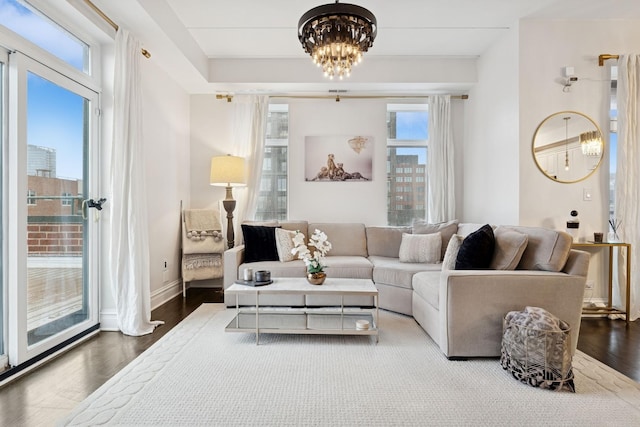 1111 W Madison St Unit 5B, Chicago, IL 60607 - living area featuring a notable chandelier and wood finished floors