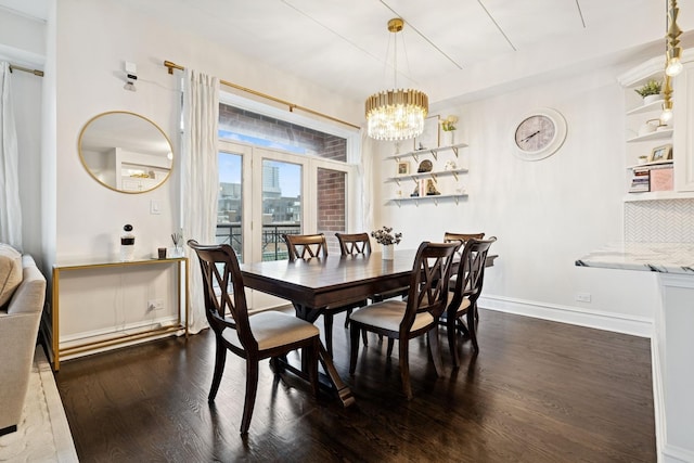 1111 W Madison St Unit 5B, Chicago, IL 60607 - dining area featuring baseboards, dark wood-style floors, and a notable chandelier