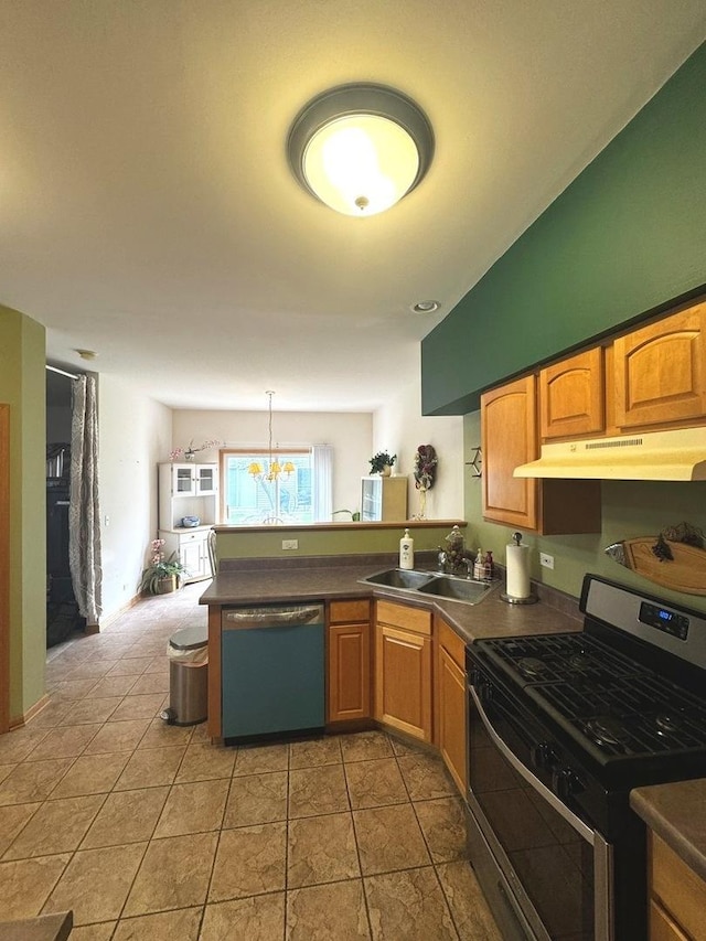 3512 Blue Ridge Ct, Carpentersville, IL 60110 - kitchen with gas range, dishwashing machine, under cabinet range hood, a sink, and a peninsula
