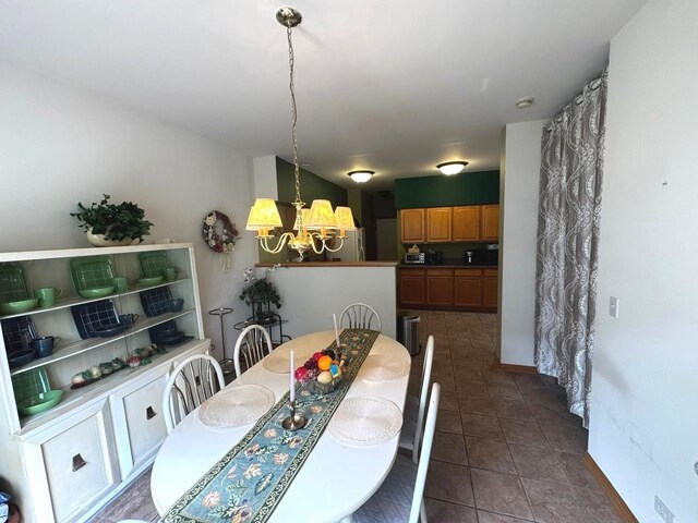 3512 Blue Ridge Ct, Carpentersville, IL 60110 - dining area featuring a chandelier and dark tile patterned flooring