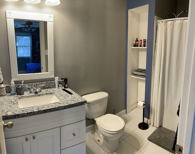 bathroom with tile patterned flooring, vanity, baseboards, toilet, and a shower with shower curtain