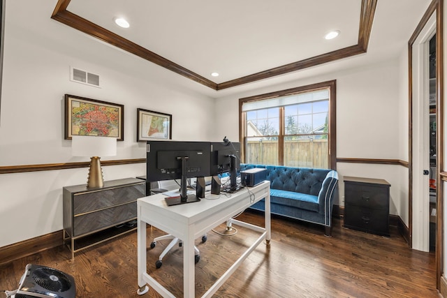 office with visible vents, crown molding, wood finished floors, a raised ceiling, and baseboards