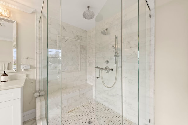 bathroom with a marble finish shower and vanity