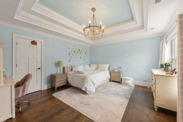 bedroom featuring an inviting chandelier, crown molding, and a tray ceiling
