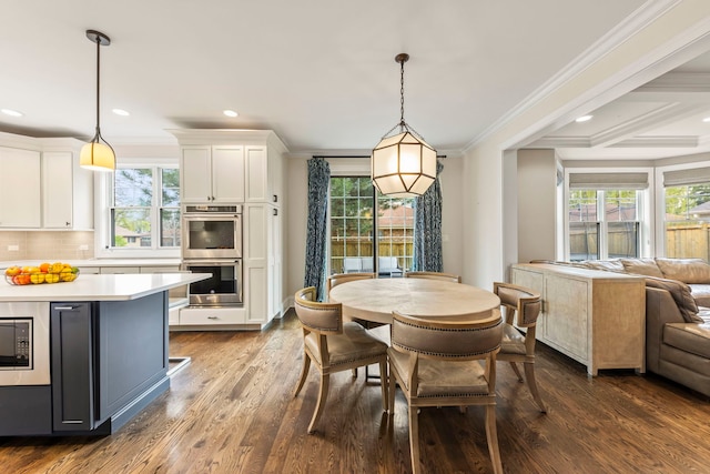 dining area featuring recessed lighting, ornamental molding, and dark wood finished floors