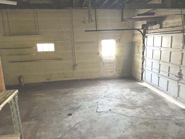garage with concrete block wall