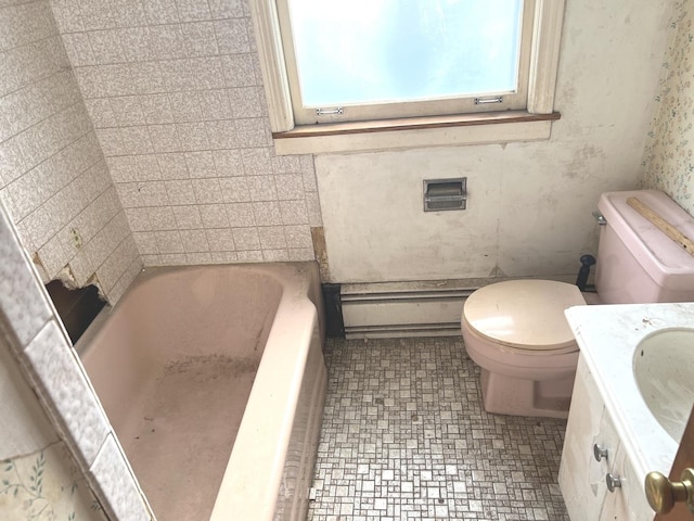 bathroom with vanity, a bathing tub, a baseboard heating unit, and toilet
