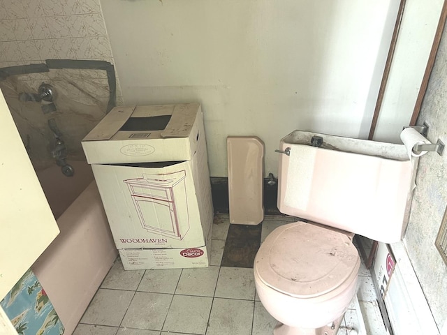 bathroom featuring tile patterned flooring and toilet