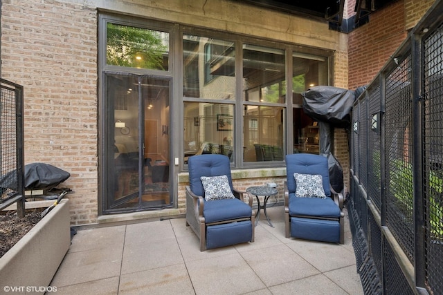1040 W Adams St Unit 203, Chicago, IL 60607 - property entrance with a patio area and brick siding