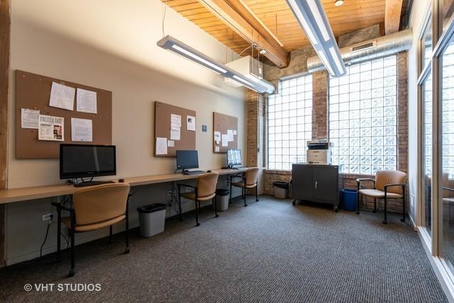 1040 W Adams St Unit 203, Chicago, IL 60607 - office area featuring wood ceiling with exposed beams and carpet