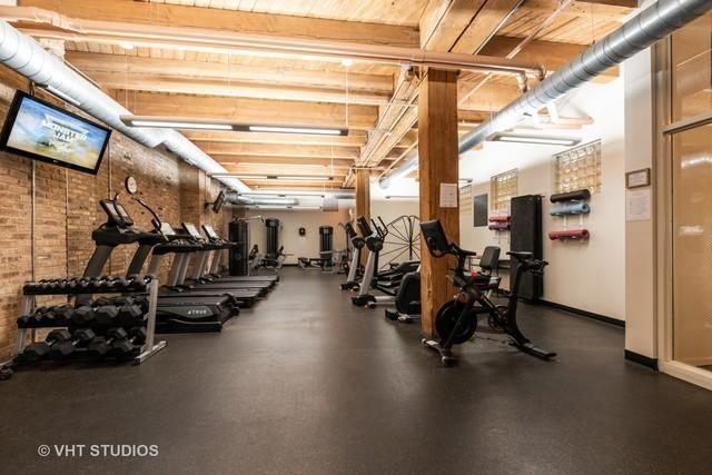 1040 W Adams St Unit 203, Chicago, IL 60607 - exercise room with baseboards