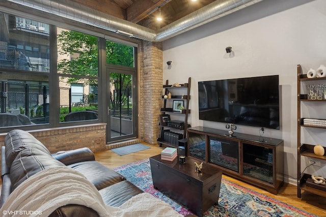 1040 W Adams St Unit 203, Chicago, IL 60607 - living area with wood finished floors and wood ceiling with exposed beams