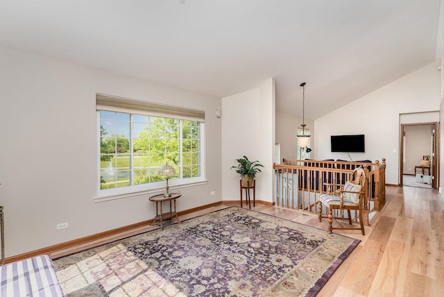 2270 Twilight Dr Unit 2270, Aurora, IL 60503 - living room with wood finished floors, vaulted ceiling, and baseboards