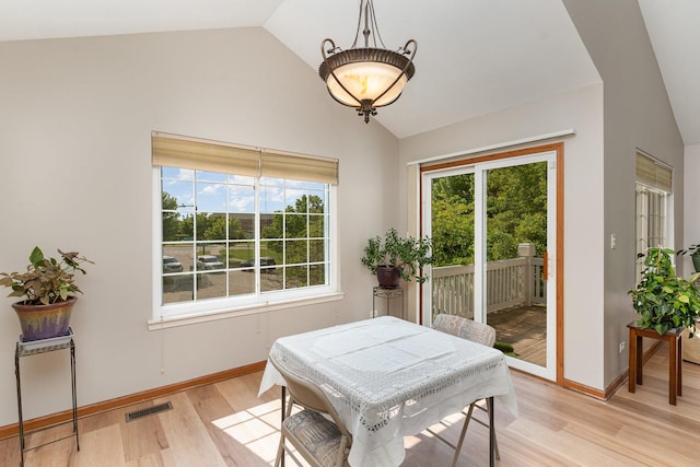 2270 Twilight Dr Unit 2270, Aurora, IL 60503 - dining room with vaulted ceiling, healthy amount of natural light, light wood-type flooring, and baseboards