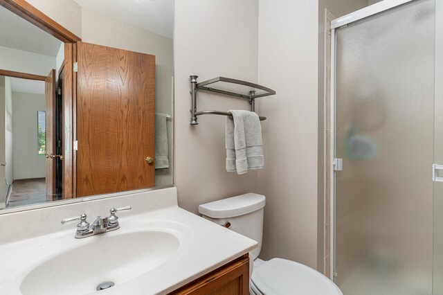 2270 Twilight Dr Unit 2270, Aurora, IL 60503 - bathroom featuring a stall shower, toilet, and vanity
