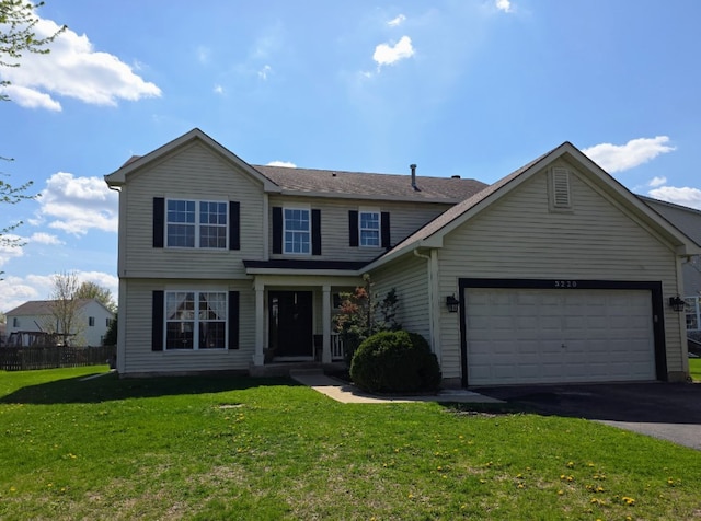 view of front of home with a garage, a front lawn, fence, and driveway