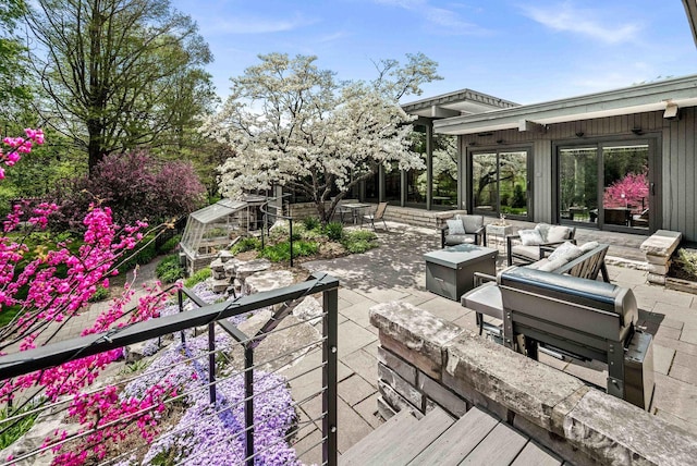 221 Parkview Dr, Bloomington, IL 61701 - wooden deck featuring a patio area, an outdoor living space, and outdoor dining space