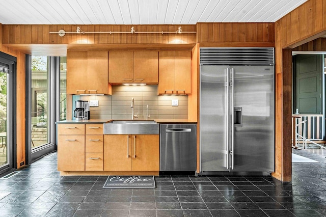 221 Parkview Dr, Bloomington, IL 61701 - kitchen with appliances with stainless steel finishes, a sink, wood walls, decorative backsplash, and wooden ceiling
