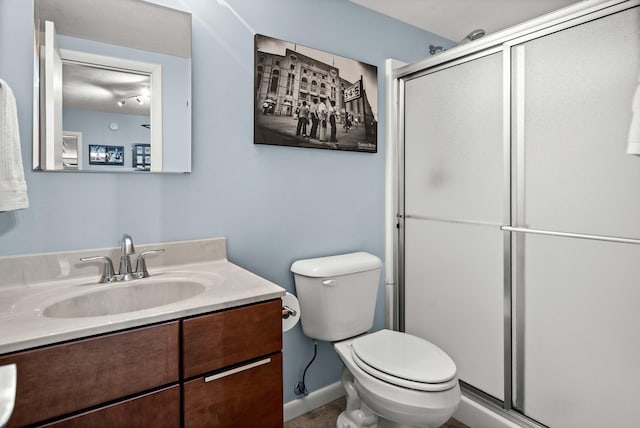 221 Parkview Dr, Bloomington, IL 61701 - bathroom featuring toilet, a shower stall, vanity, and baseboards