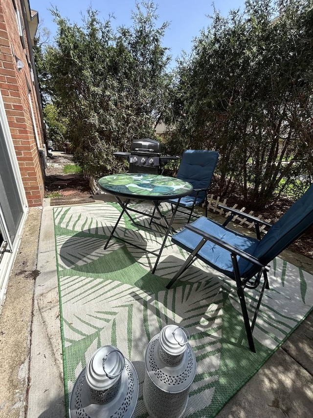 1216 S New Wilke Rd Unit 106, Arlington Heights, IL 60005 - view of patio with area for grilling and outdoor dining space