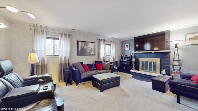 carpeted living room with a healthy amount of sunlight, ornamental molding, and a fireplace