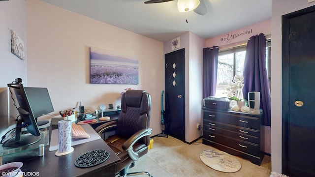 office area featuring a ceiling fan and light colored carpet