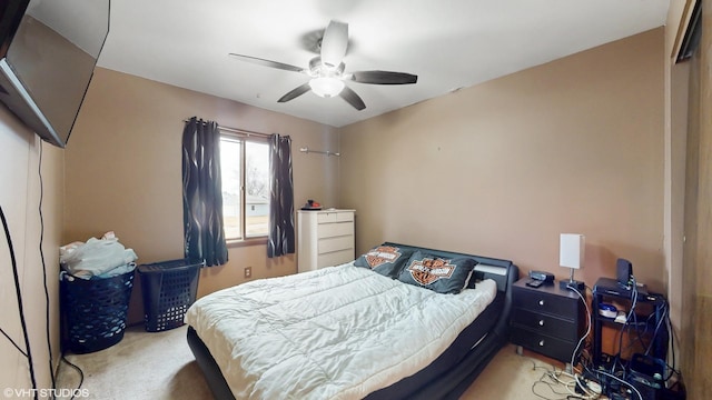 carpeted bedroom with a ceiling fan