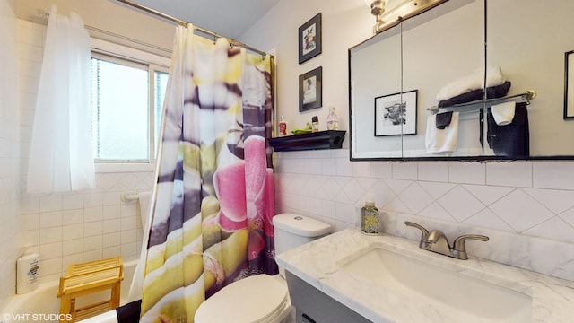 full bathroom featuring vanity, toilet, shower / bath combination with curtain, tile walls, and tasteful backsplash