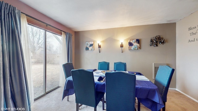 dining space featuring baseboards, carpet, and visible vents