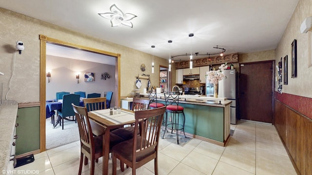 dining room with light tile patterned flooring