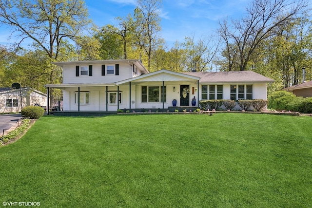 view of front of home with covered porch and a front yard