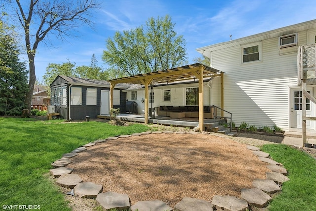 rear view of property with outdoor lounge area, a pergola, a yard, and a deck