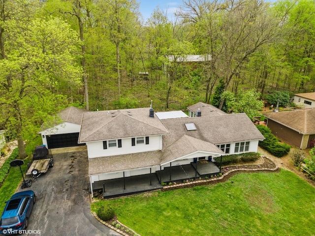 view from above of property with a forest