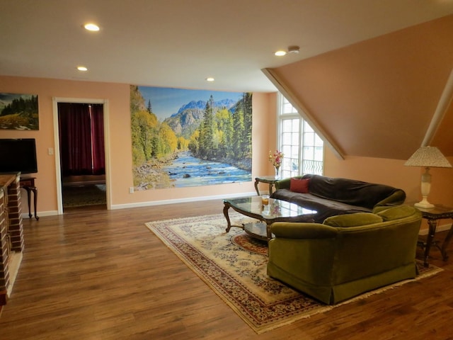 living room featuring baseboards, recessed lighting, and wood finished floors