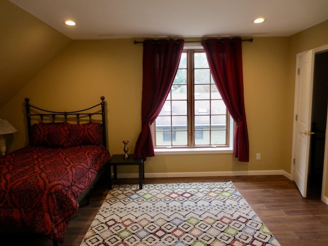 bedroom featuring multiple windows, recessed lighting, and wood finished floors