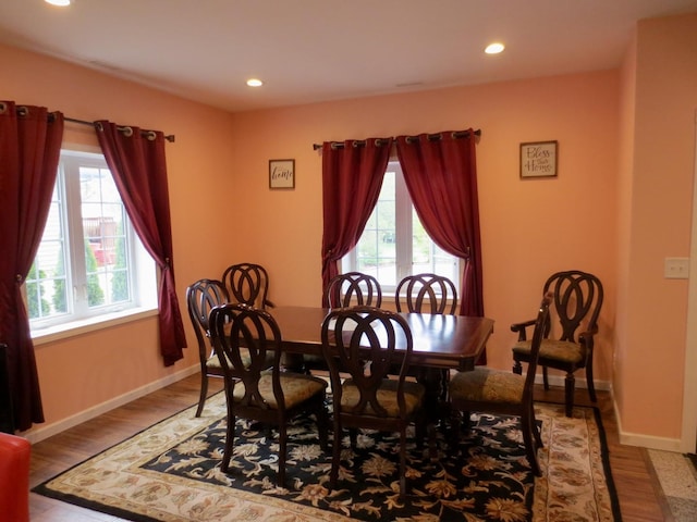dining area with recessed lighting, wood finished floors, and a wealth of natural light