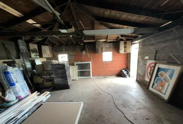 below grade area featuring concrete block wall