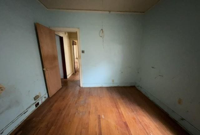 unfurnished room featuring wood finished floors