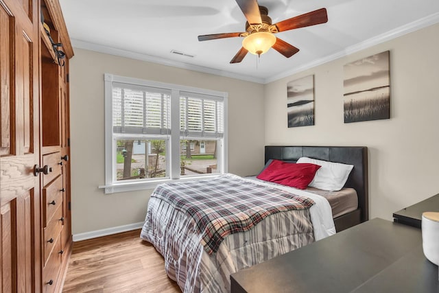 3010 Mary Ln, Mchenry, IL 60051 - bedroom featuring crown molding, visible vents, wood finished floors, baseboards, and a ceiling fan