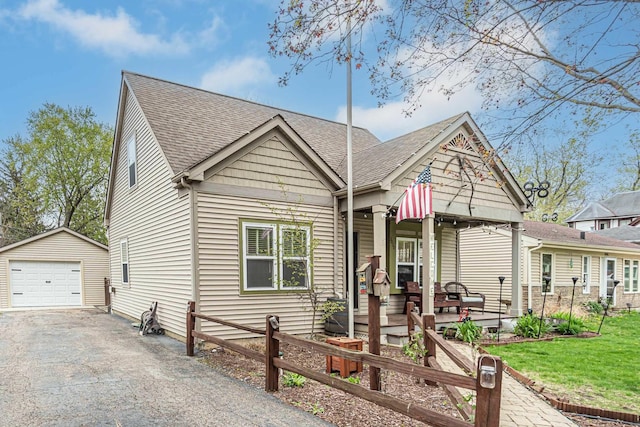3010 Mary Ln, Mchenry, IL 60051 - bungalow-style house featuring a garage, fence, an outdoor structure, aphalt driveway, and a shingled roof