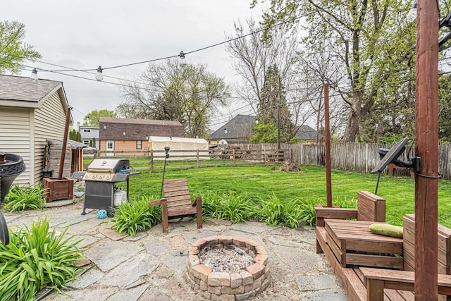 3010 Mary Ln, Mchenry, IL 60051 - view of patio / terrace featuring a fenced backyard, an outdoor fire pit, and grilling area