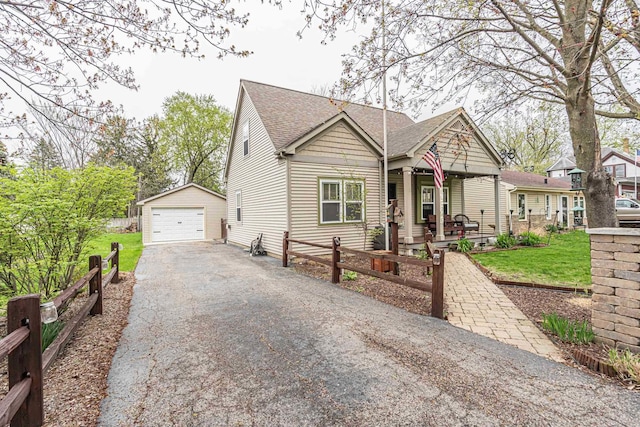 3010 Mary Ln, Mchenry, IL 60051 - bungalow-style home with covered porch, driveway, roof with shingles, a garage, and an outdoor structure