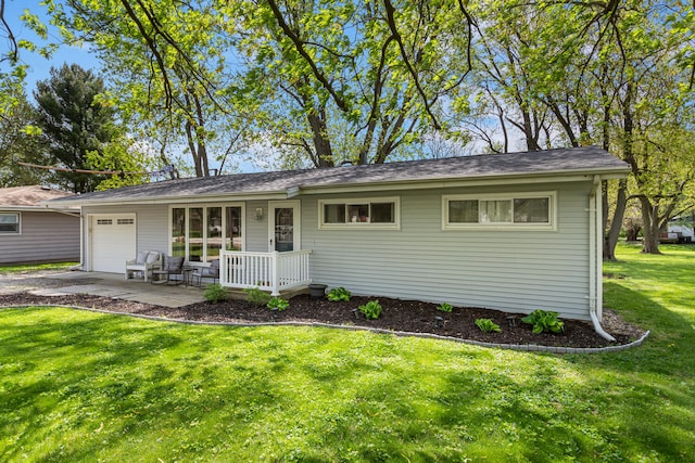 310 S Elm St, Saint Joseph, IL 61873 - single story home featuring an attached garage, driveway, a front yard, and a porch