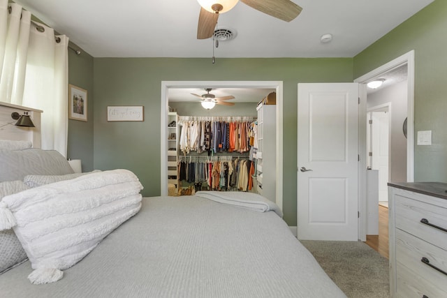 310 S Elm St, Saint Joseph, IL 61873 - bedroom with a closet, a ceiling fan, visible vents, and light colored carpet