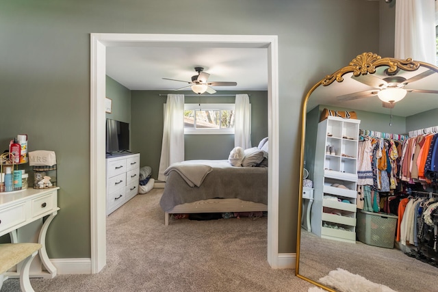 310 S Elm St, Saint Joseph, IL 61873 - bedroom with light colored carpet, baseboards, and ceiling fan